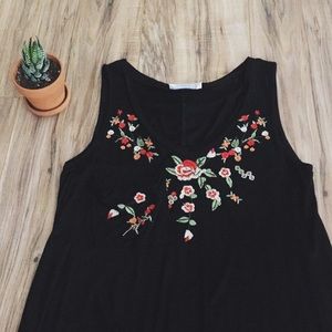 Last one - Floral embroidered slouch pocket top.